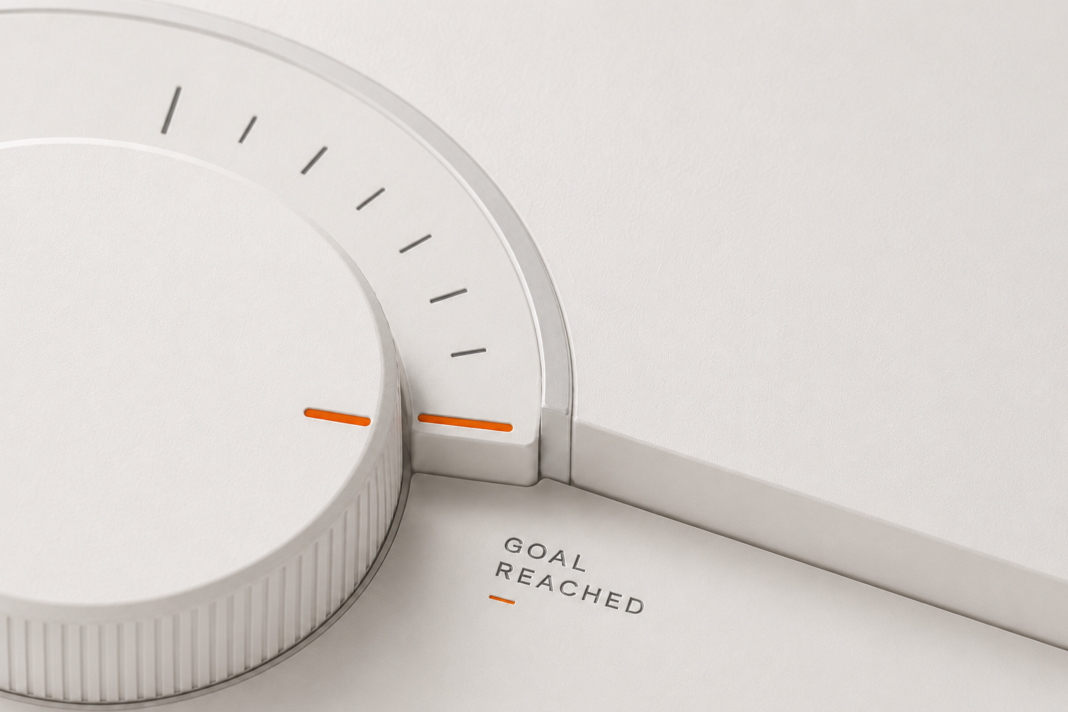 A dial turned to a marked limit, labelled Goal Reached
